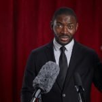 African-American Motivational Speaker on Stage