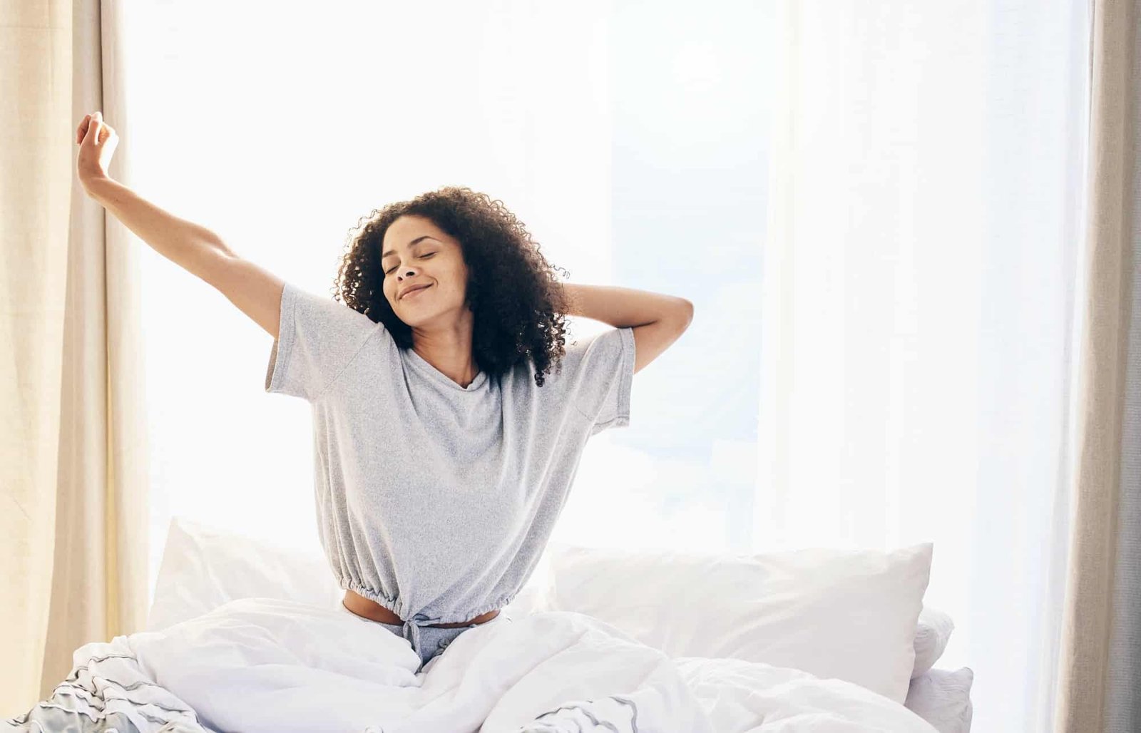 black woman, morning stretching and waking up in home bedroom after sleeping or resting. relax, pea Black woman, morning stretching and waking up in home bedroom after sleeping or resting. Relax, pea