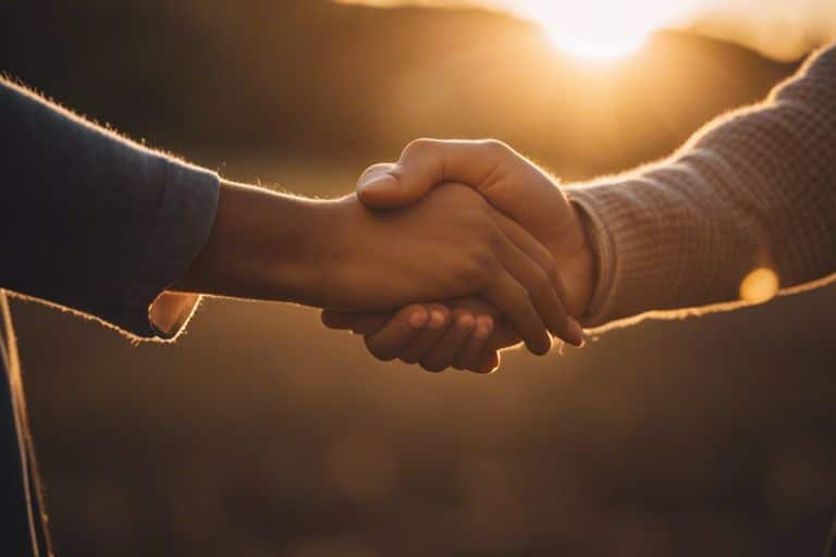 enhancing social wellbeing techniques uru Two people handshake in sunset light.
