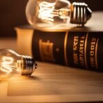 Illuminated light bulbs on book, concept of idea and innovation.