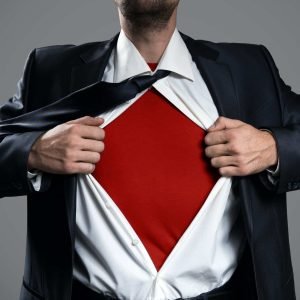 Businessman Acting Like A Super Hero And Tearing His Shirt.
